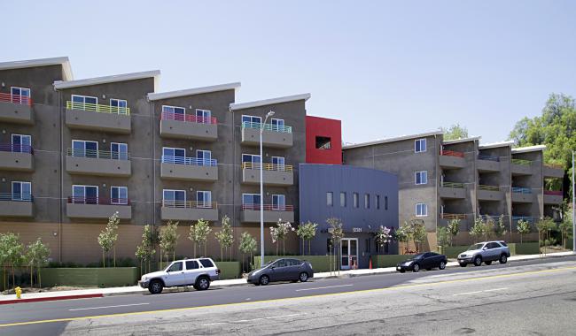 Four cars parked in front of Moonlight Villas in Pacoima